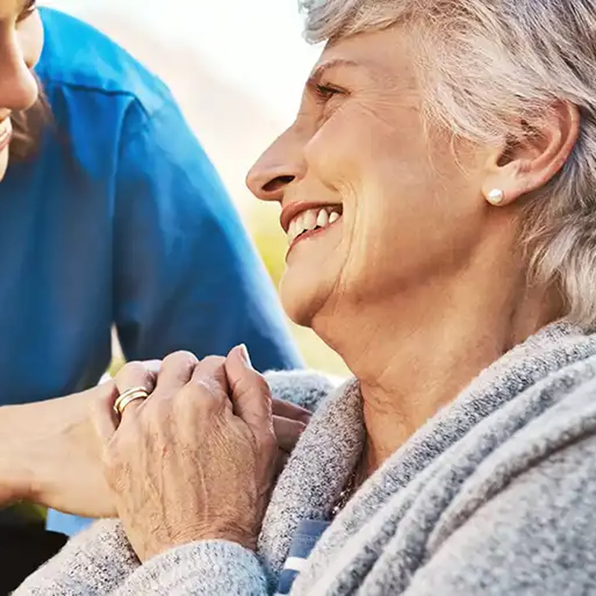 A caregiver providing compassionate support to an older adult